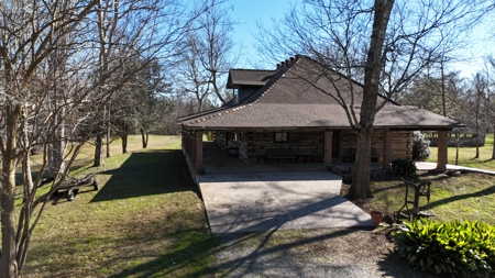 A Rare Riverfront Log Cabin Retreat in Butte La Rose - image 4