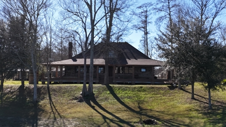 A Rare Riverfront Log Cabin Retreat in Butte La Rose - image 13