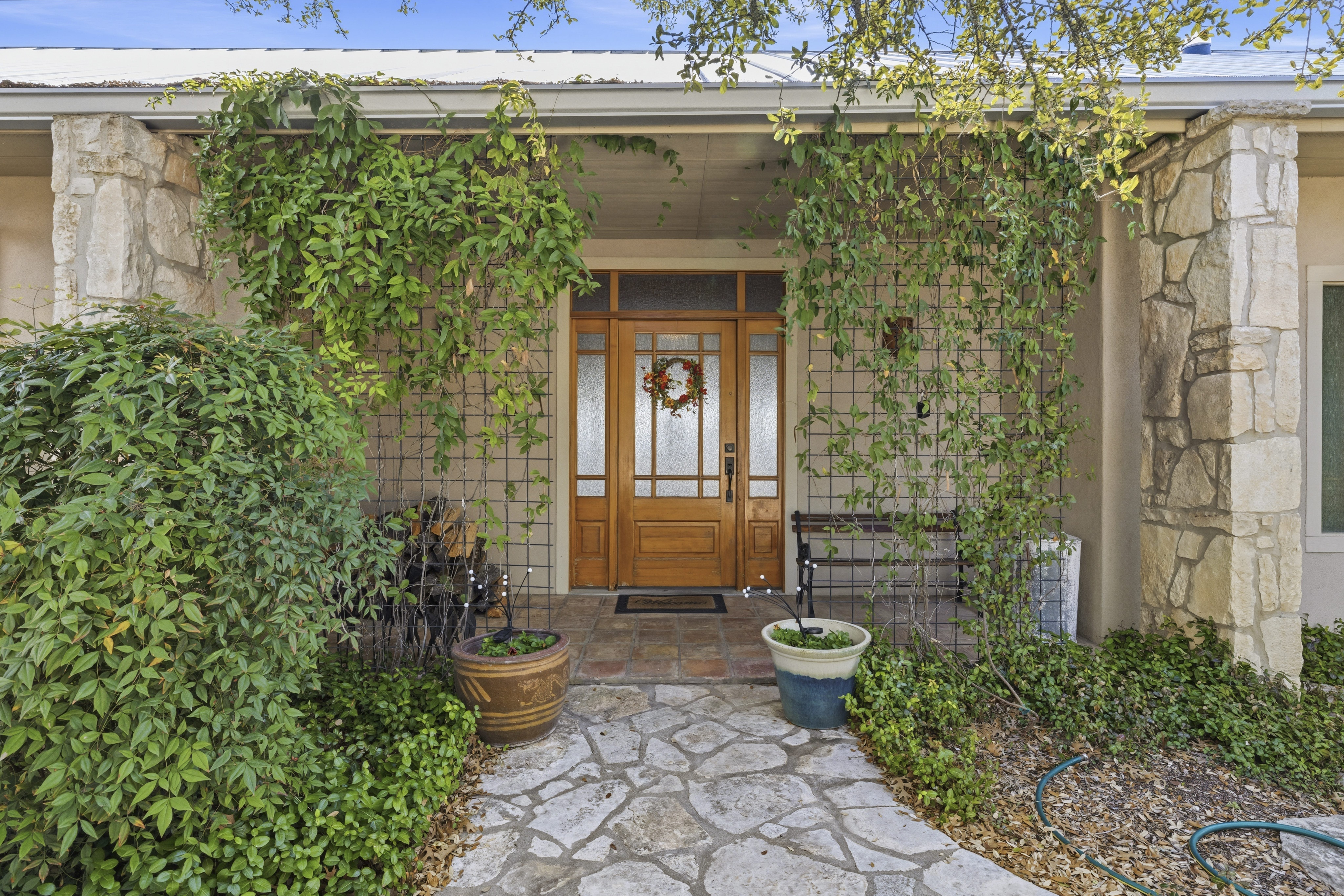Entrance to property with stone siding
