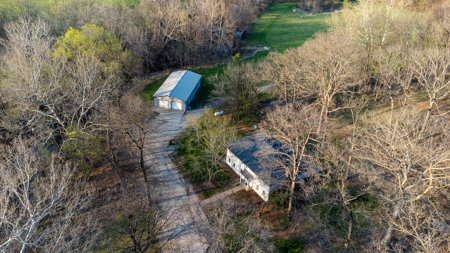 12± Acres with Creek, Shop & Spacious Home Near Cameron - image 2