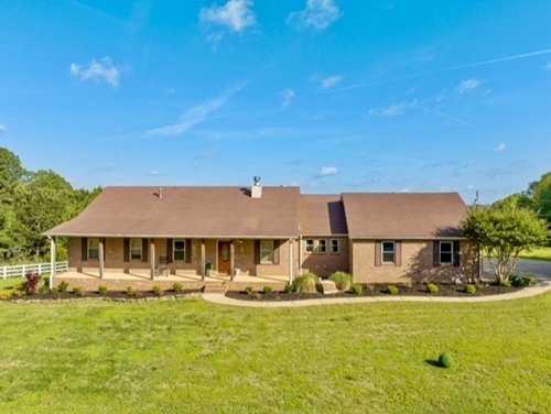 Country Home with acreage near Jonesboro AR featuring pond, barn and hilltop setting