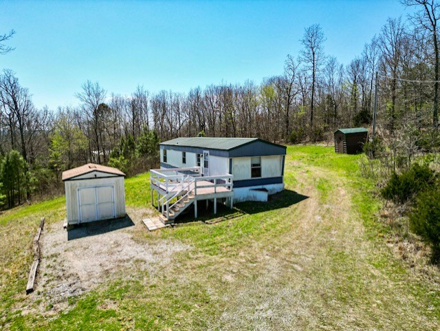 Aerial view of mobile home on 5 acres in Ravenden AR showing hilltop setting and private location in Randolph County 