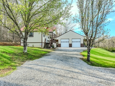 Creekfront Land for Sale in Tennessee with Pond, Shop, and Cabins - image 3