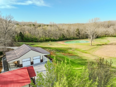 Creekfront Land for Sale in Tennessee with Pond, Shop, and Cabins - image 4
