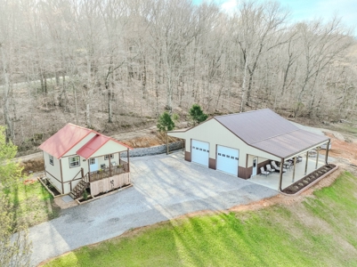 Creekfront Land for Sale in Tennessee with Pond, Shop, and Cabins - image 2