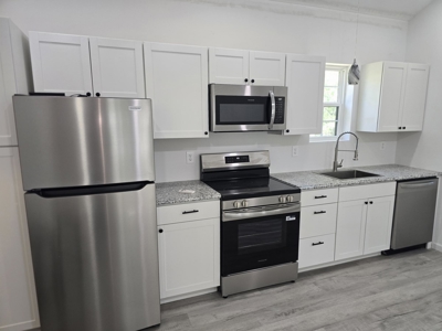 Affordable lake-area retreat with income potential - image 9