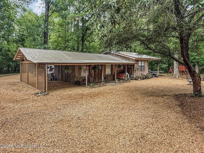 23 Acres of Riverfront Property with Sand Bar and Cabins - image 4