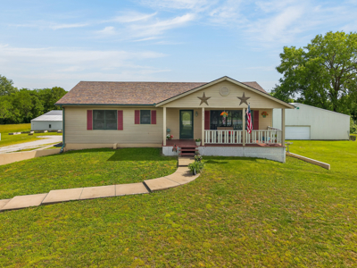 Country Home with Acreage and Shop Buildings Near KC - image 2