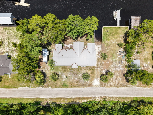 Canal-Front Opportunity With 3 Lots & Private Boat Ramp