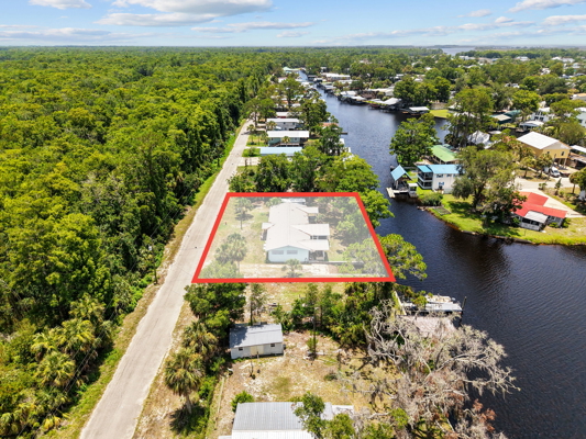 Canal-Front Opportunity With 3 Lots & Private Boat Ramp
