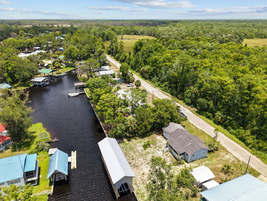 Canal-Front Opportunity With 3 Lots & Private Boat Ramp