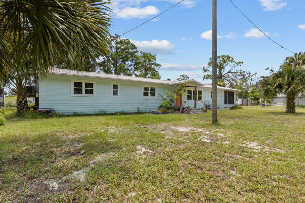 Canal-Front Opportunity With 3 Lots & Private Boat Ramp