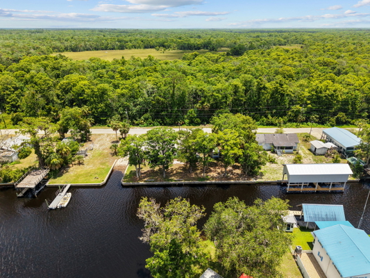 Canal-Front Opportunity With 3 Lots & Private Boat Ramp