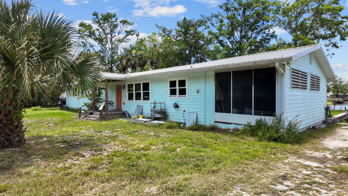 Canal-Front Opportunity With 3 Lots & Private Boat Ramp