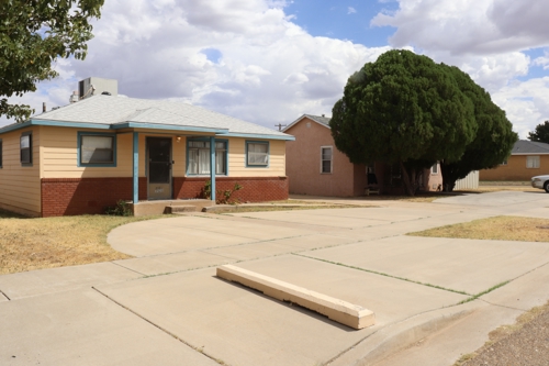 Two neighboring homes for sale on South Second Street in Tucumcari, New Mexico