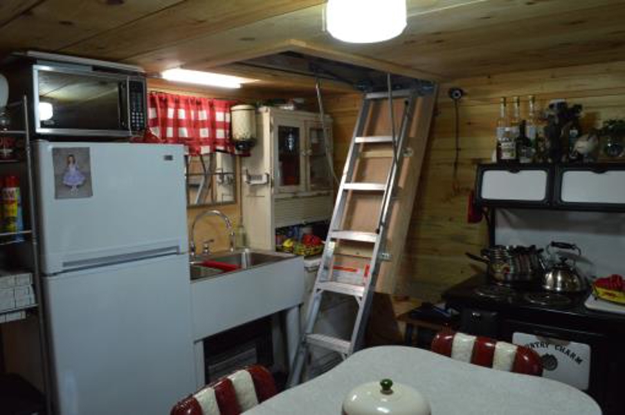 Kitchen Ladder Leads To Bedroom Upstairs