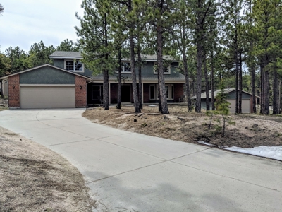 Beautiful two-story Woodmoor home on .88 treed acres - image 1